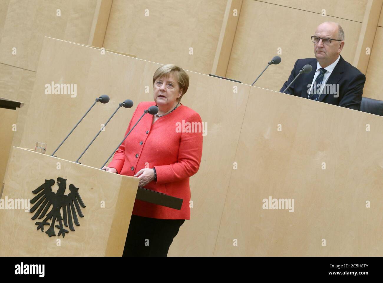 Berlin, Germany. 03rd July, 2020. Chancellor Angela Merkel (CDU) gives a speech in the Bundesrat on the objectives of the EU Council Presidency. Dietmar Woidke (SPD), President of the Bundesrat, follows the speech. Credit: Wolfgang Kumm/dpa/Alamy Live News Stock Photo