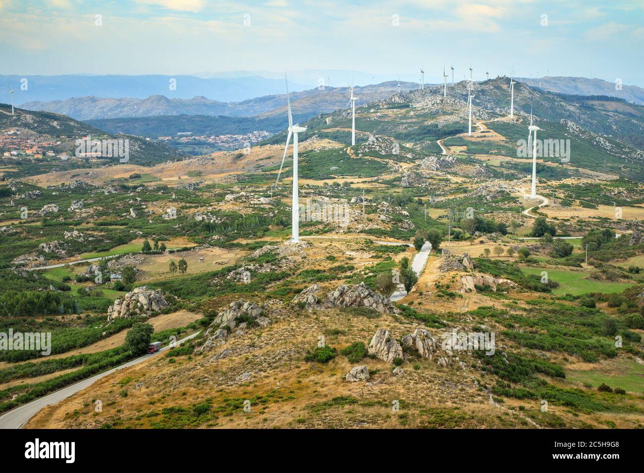 Serra do Caramulo wind farm, in Portugal, seen from the top of Caramulinho, at sunset. Stock Photo
