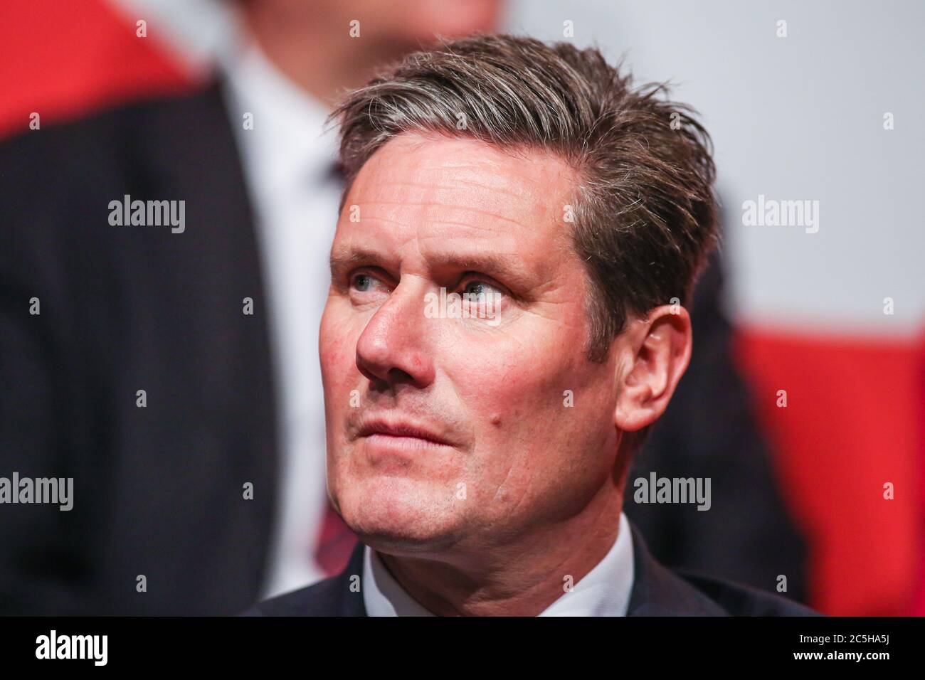 Shadow Brexit Secretary Keir Starmer watches on as Labour Leader Jeremy Corbyn addresses supporters and the media at a rally in Manchester to launch t Stock Photo
