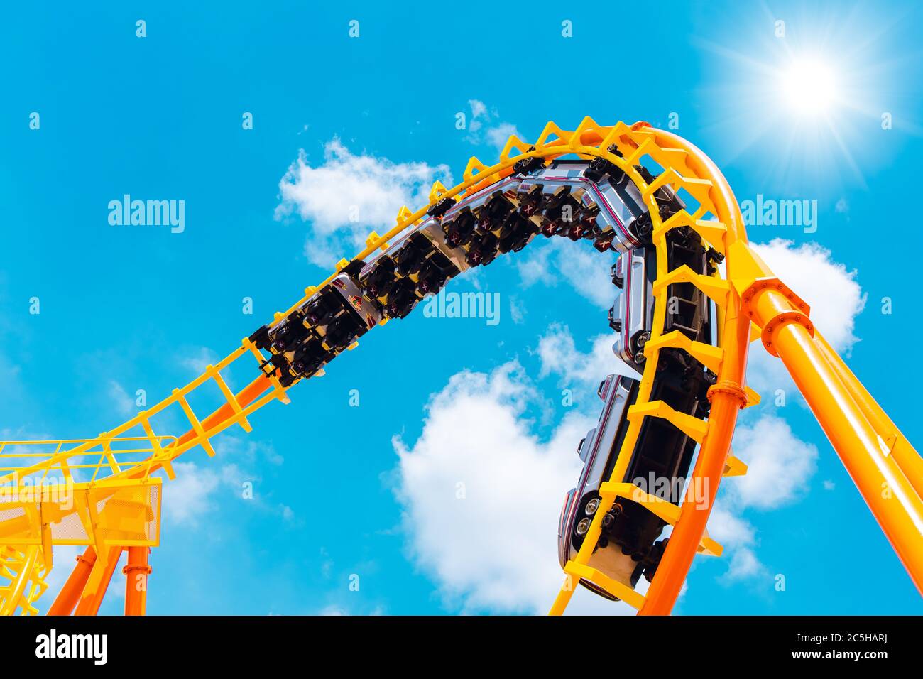 Rollercoaster railroad car no people testing track high to the sky roll bend and twist for exciting fun people at theme park during Coronavirus(Covid- Stock Photo