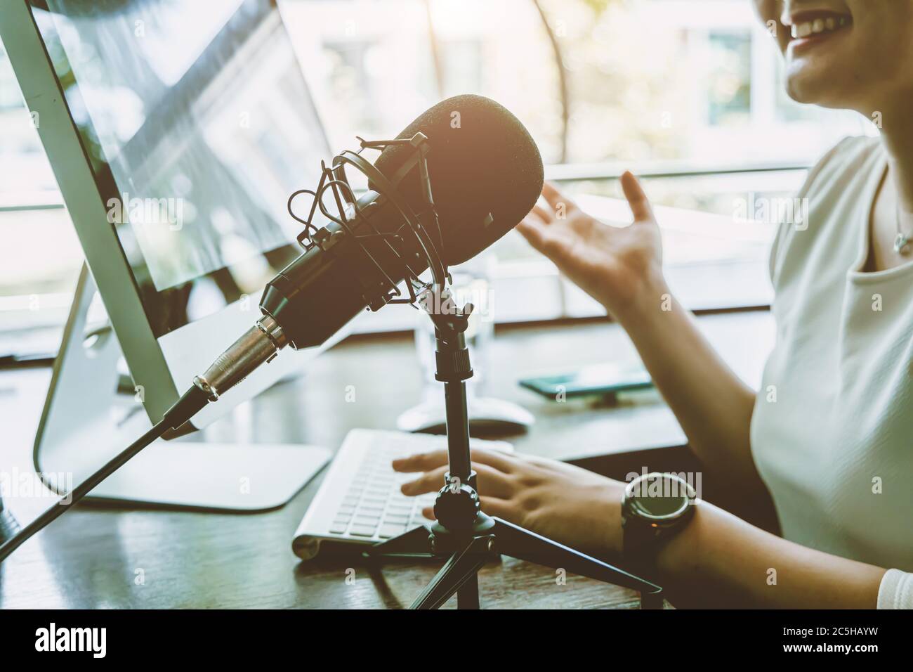 People working at home for making internet radio broadcasting channel live streaming talking meeting or discussion closeup condenser microphone. Stock Photo