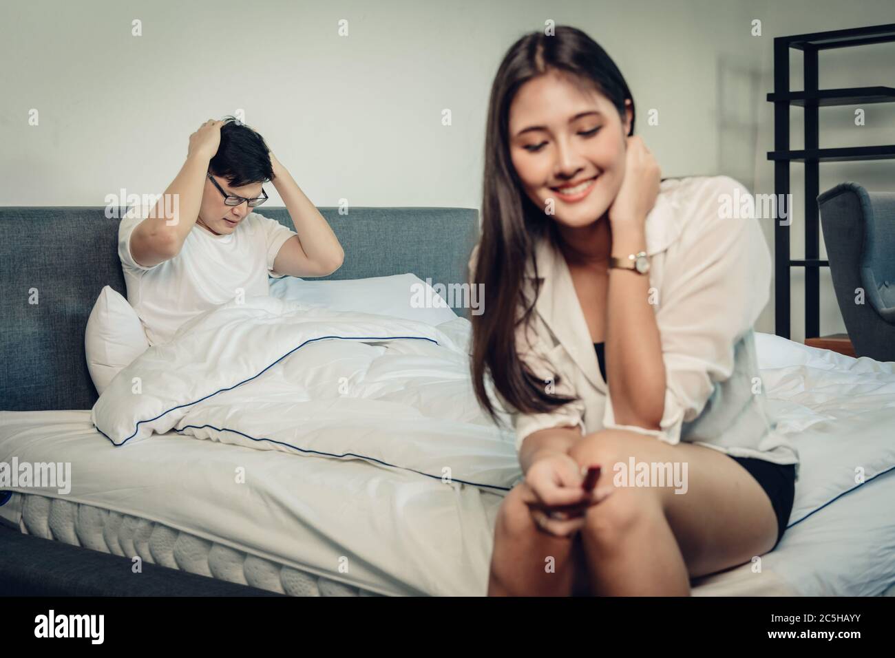 Unplanned Pregnancy concept, Wife is happy to know she pregnant while the husband boyfriend is stress and feel not ready to be father Stock Photo photo