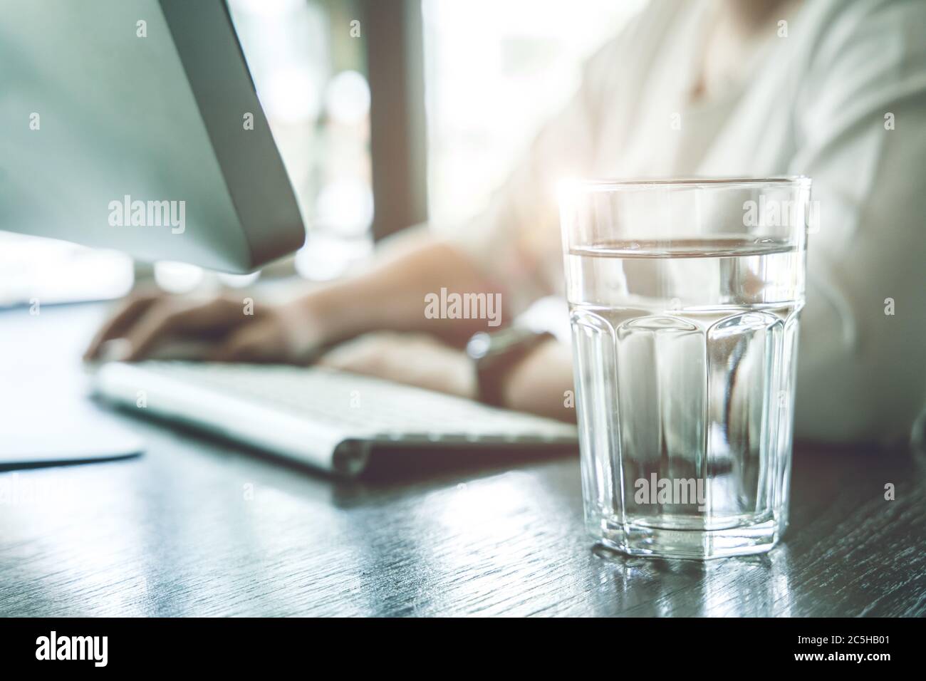 Drink clean room temperature water during working time for healthy and