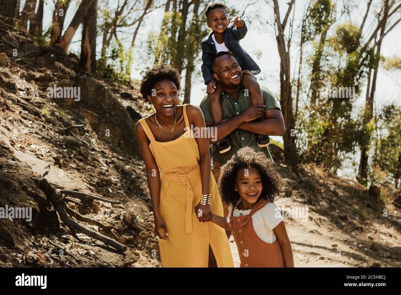 African family walking down a mountain trail. Young family enjoying their holidays in a national park Stock Photo Alamy