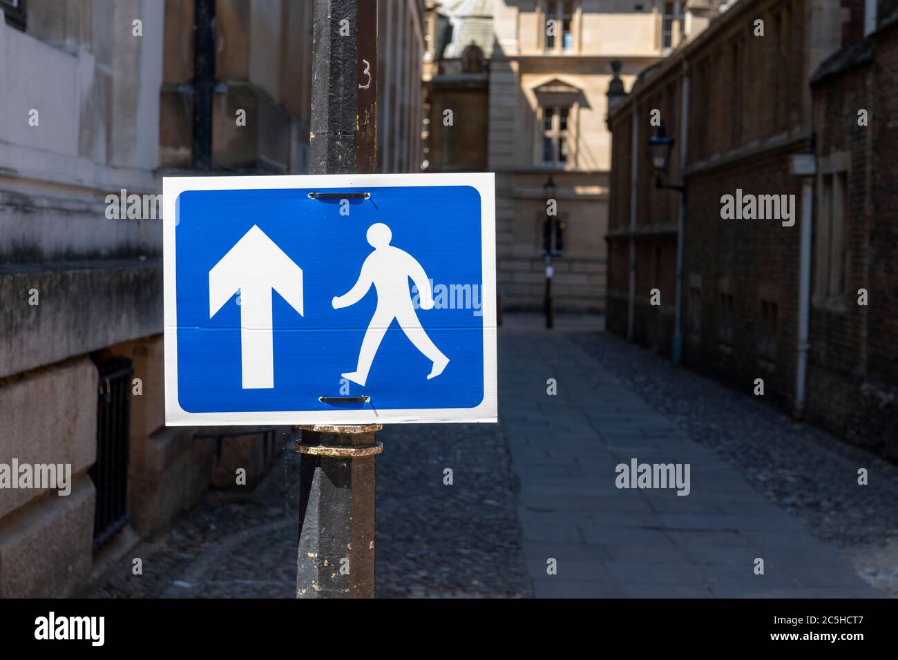 A one way pedestrian flow sign in Cambridge City centre to create social distancing in the coronavirus and covd 19 crisis in the UK Stock Photo