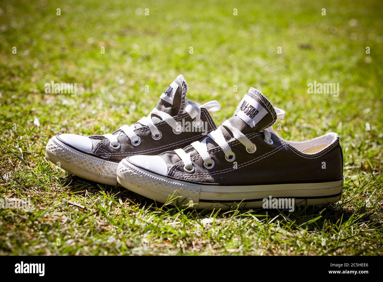 Converse shoes grass hi-res stock photography and images - Alamy