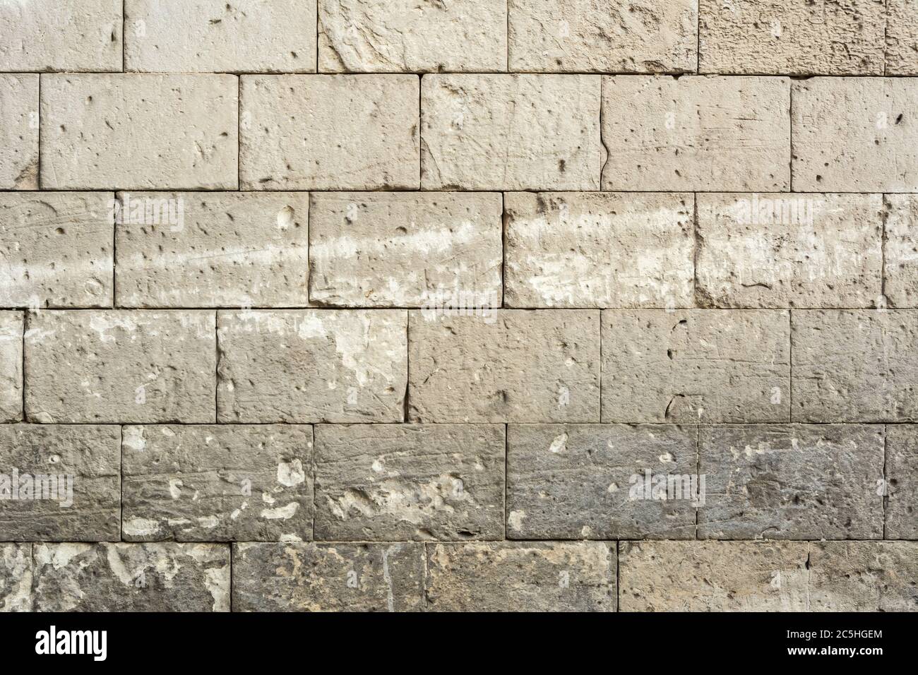 Background: grey weathered stone wall Stock Photo