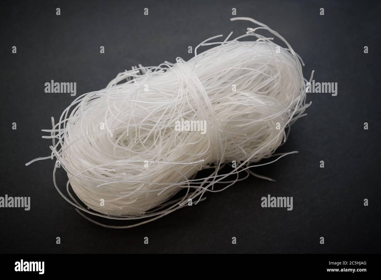 Cellophane noodles or fensi on black background. Stock Photo