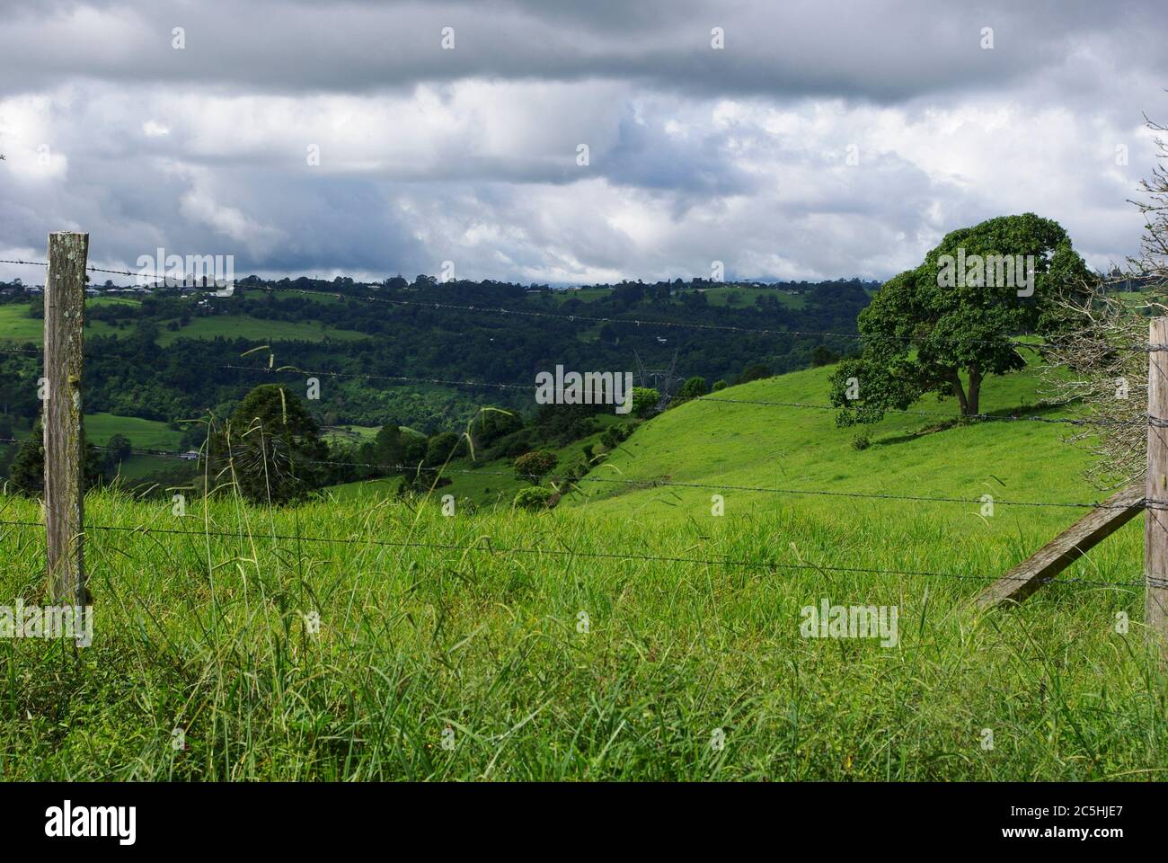Overlooking Obi Obi Valley through barbed wire fence at Witta Maleny Stock Photo