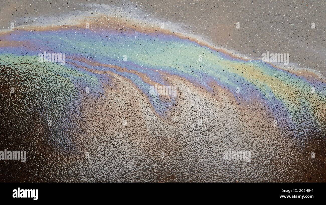 Gasoline flows on the pavement. Stock Photo