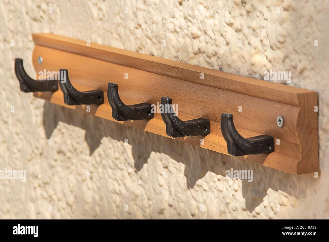 Towel hook. Empty bathroom rack. cloth hanger. classic exterior hotel bath garment storage. elegance vintage wooden holder. close-up of retro wall bat Stock Photo