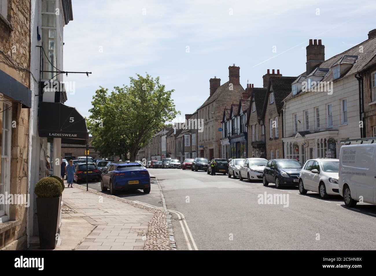 Street side commercial properties on The High Street in Woodstock, Oxfordshire in the UK Stock Photo