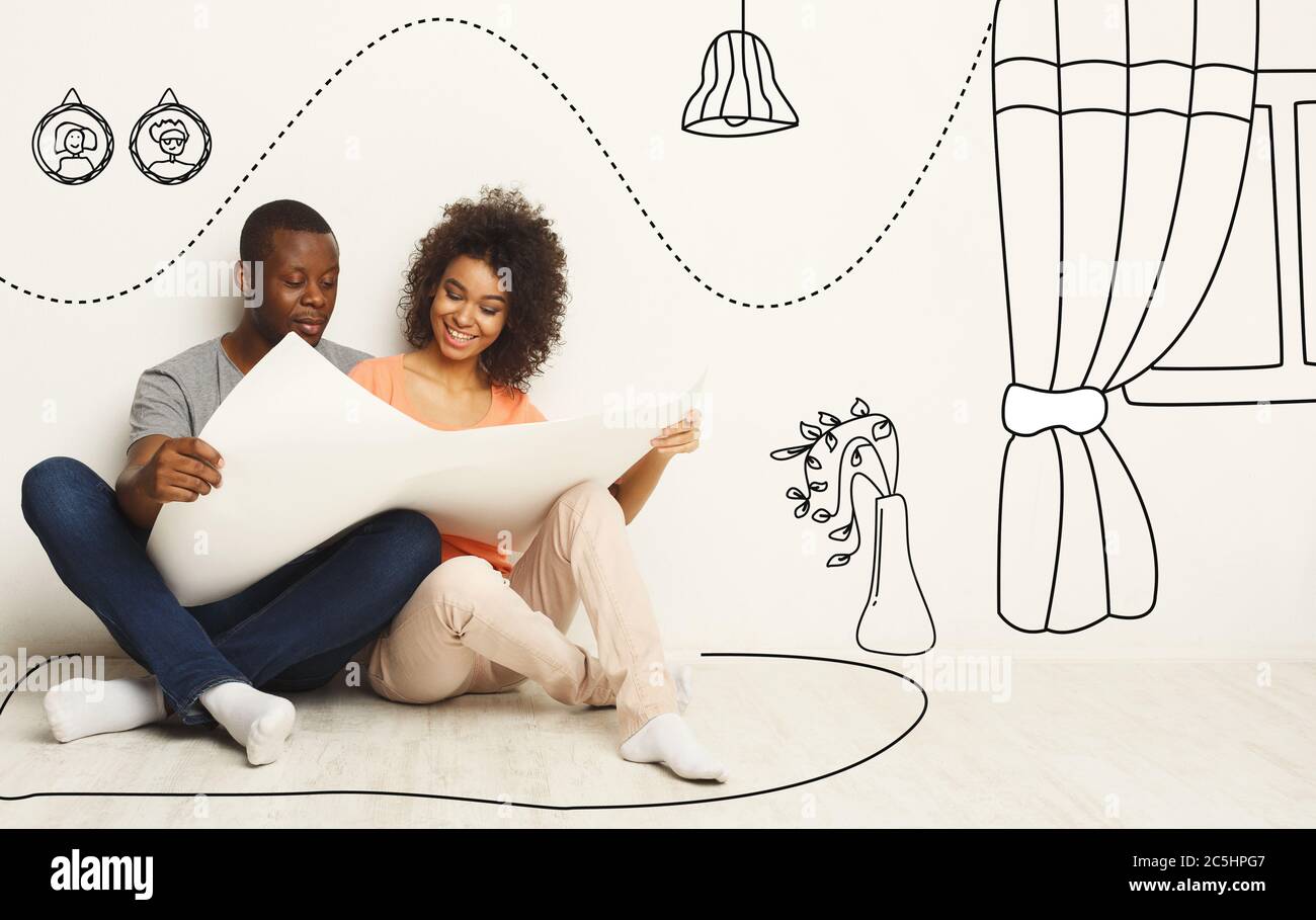 Black couple holding house plan and dreaming about new interior design, collage with drawings on white wall Stock Photo