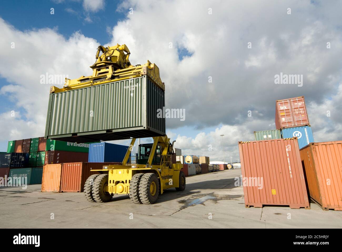 CVS Ferrari reach stacker being used to move shipping containers at
