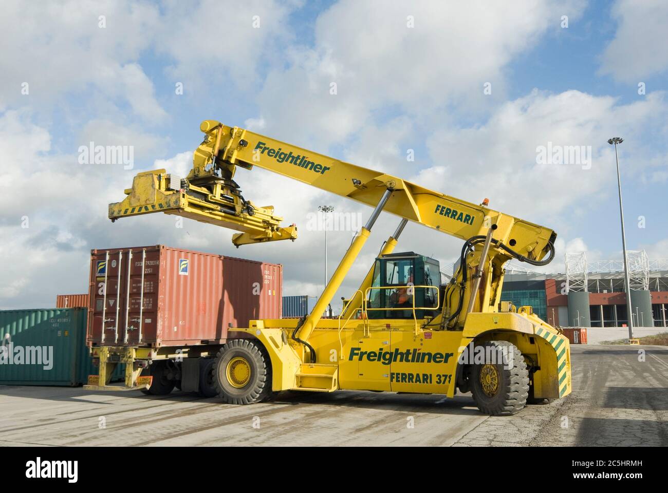 CVS Ferrari reach stacker being used to move shipping containers at
