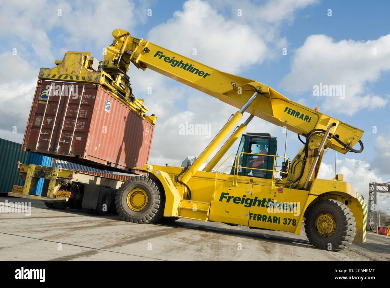 CVS Ferrari reach stacker being used to move shipping containers at