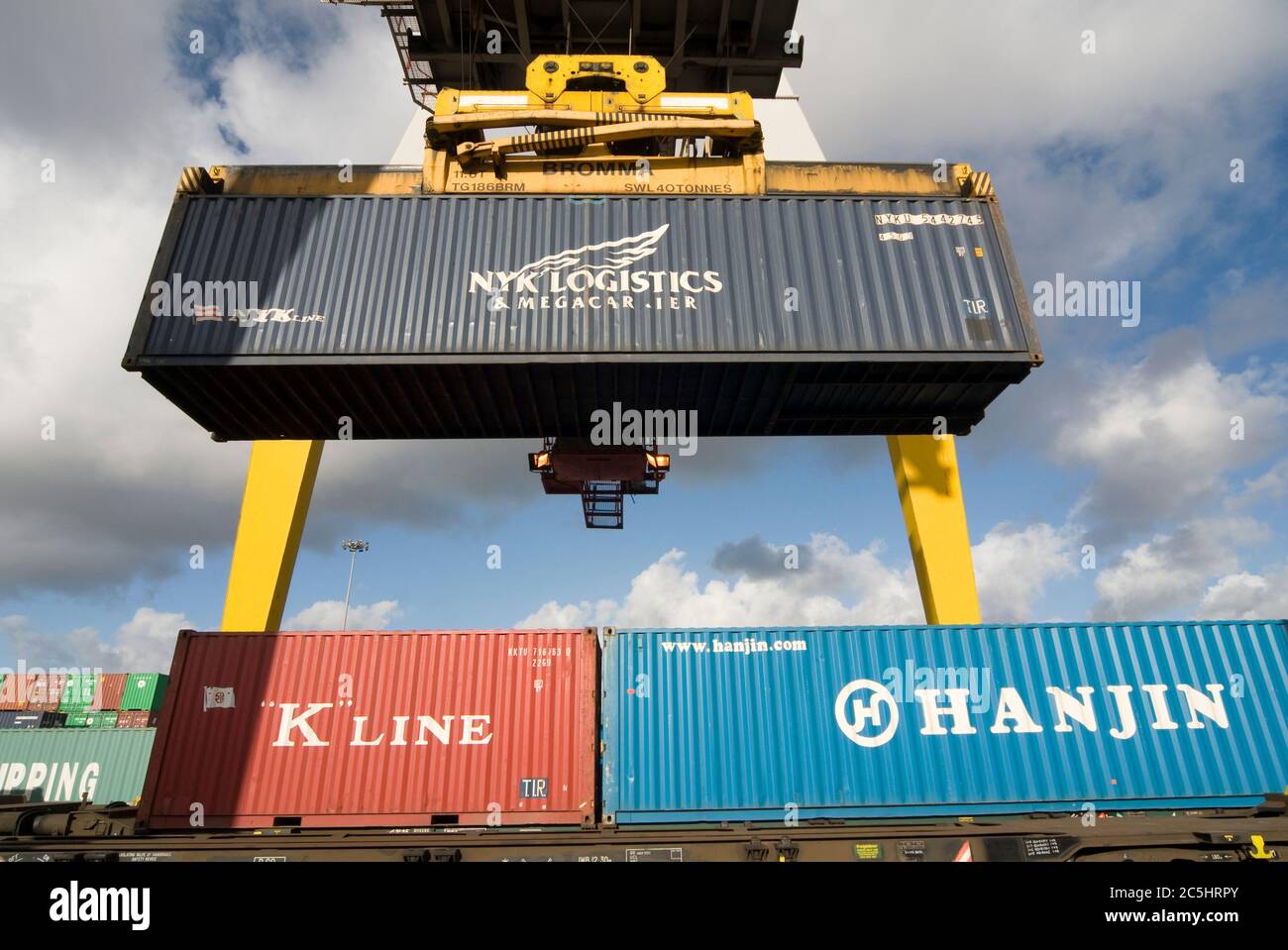 Rail mounted crane being used to load and unload shipping containers at ...