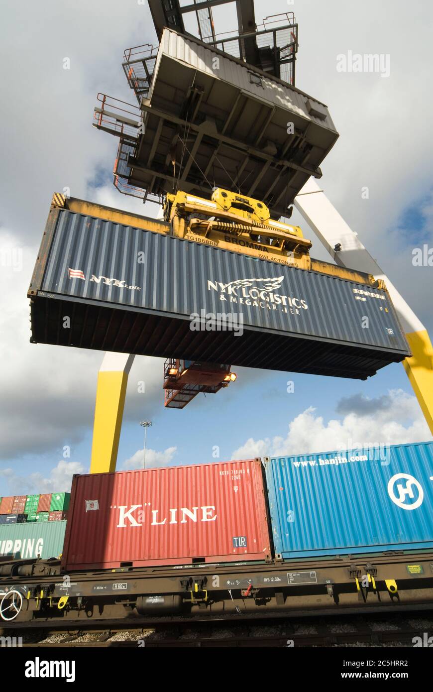 Rail mounted crane being used to load and unload shipping containers at ...