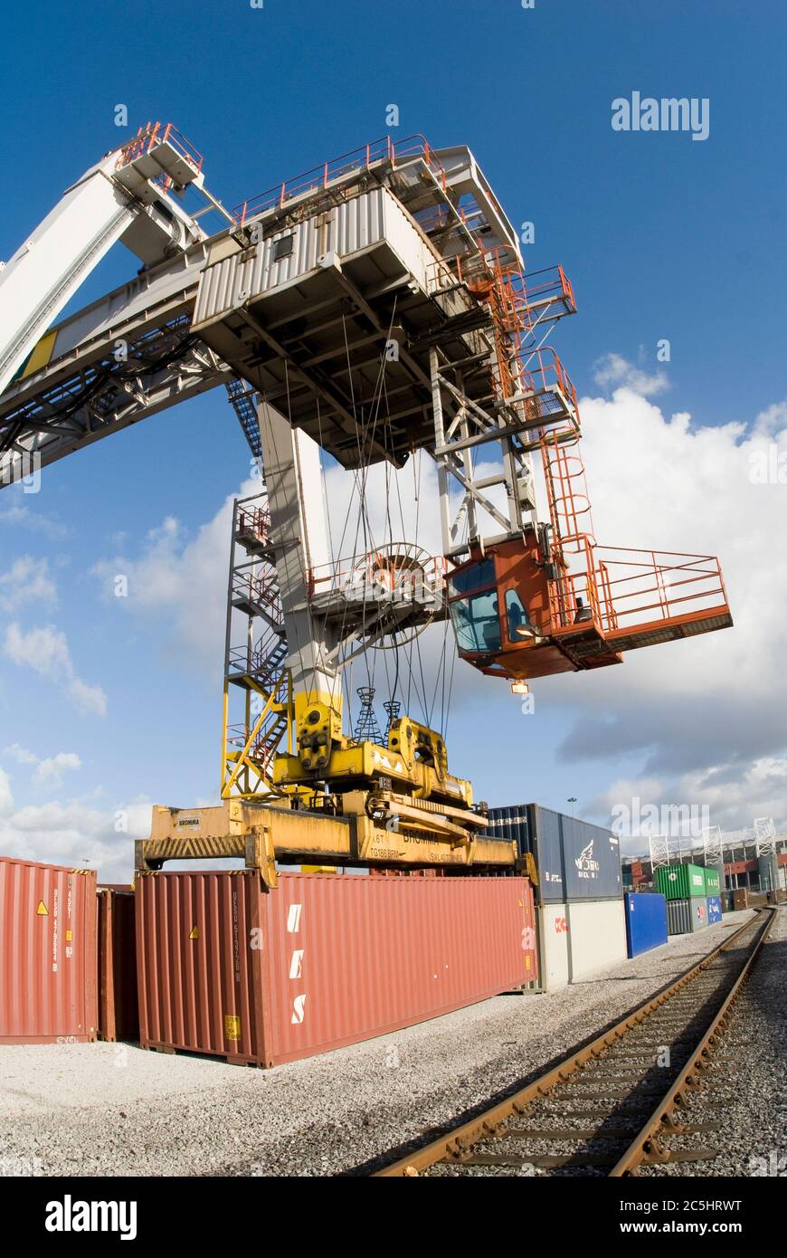 Rail mounted crane being used to load and unload shipping containers at ...