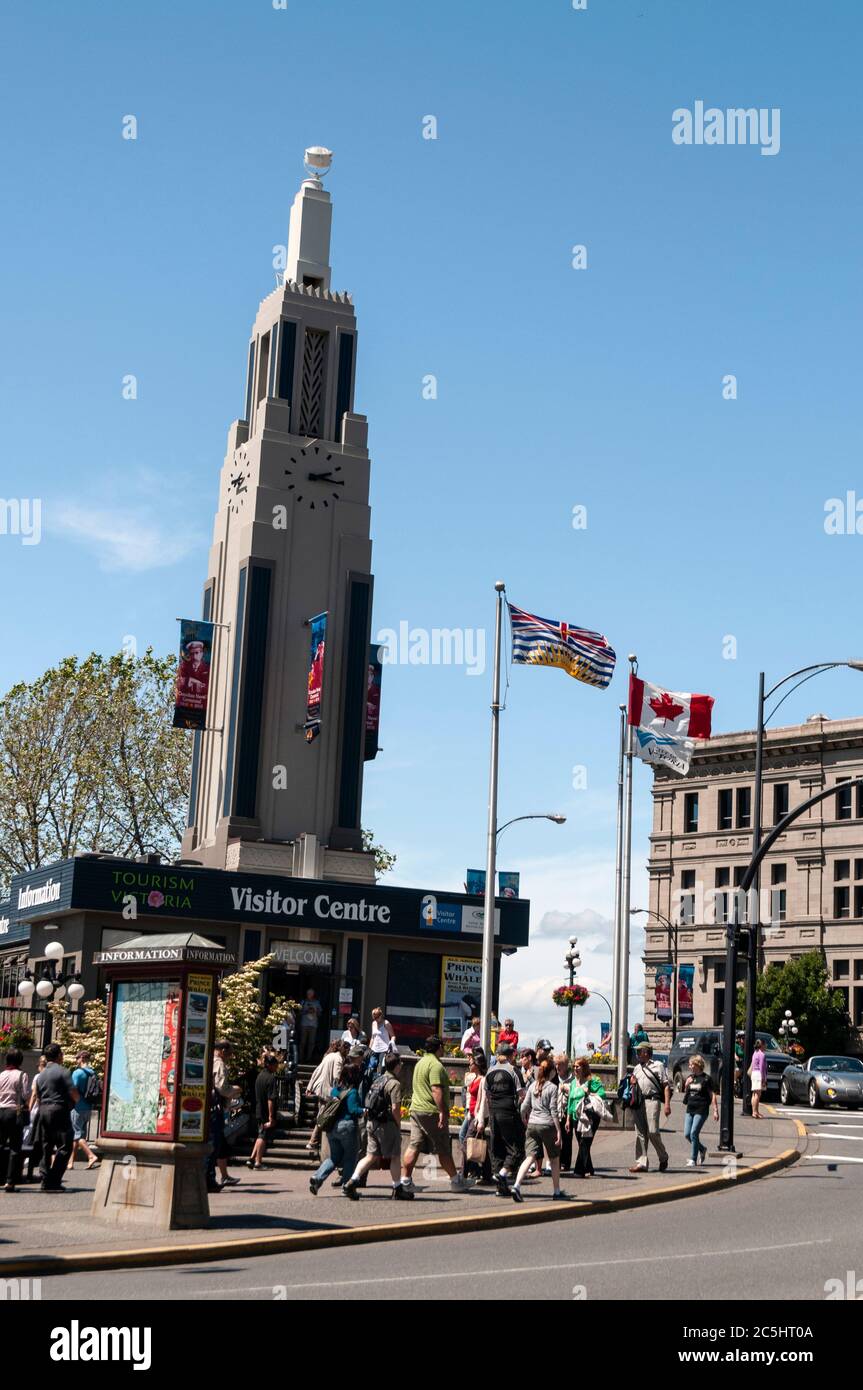 The Visitor Information Centre with a tall clock tower on the harbour