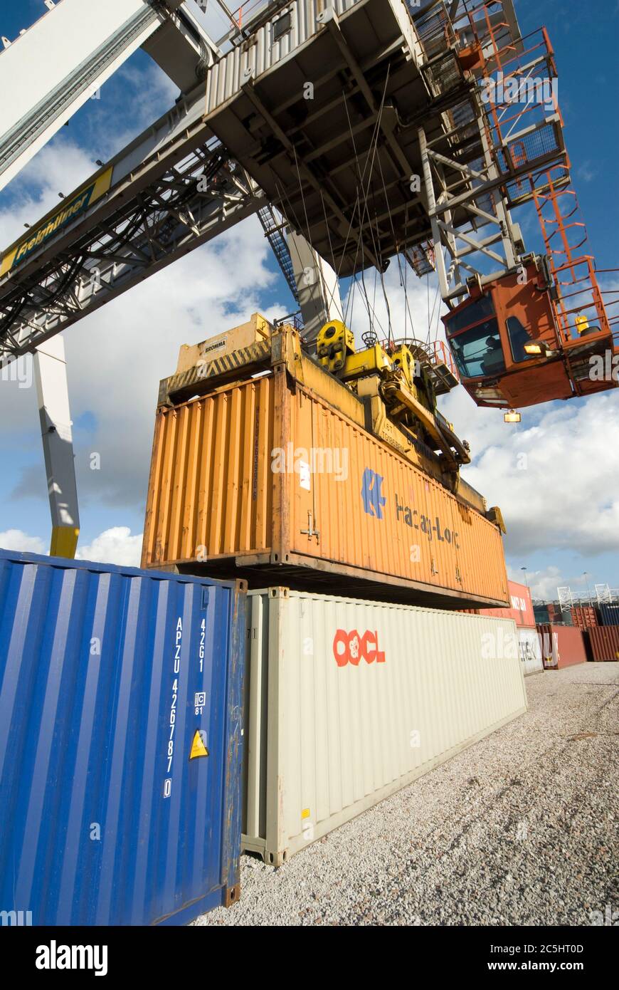 Rail mounted crane being used to load and unload shipping containers at ...