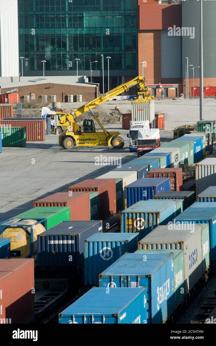 CVS Ferrari reach stacker being used to load a shipping container onto