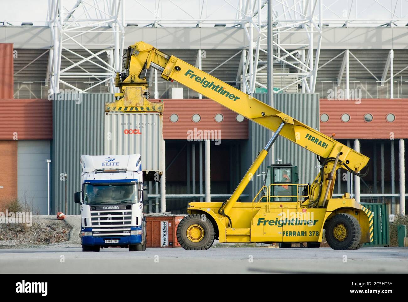 CVS Ferrari reach stacker being used to move shipping containers at