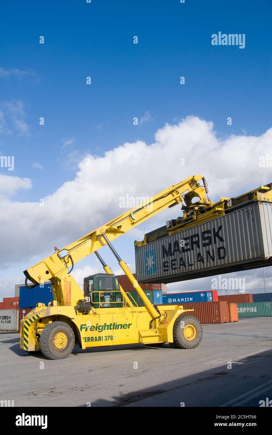 CVS Ferrari reach stacker being used to move shipping containers at