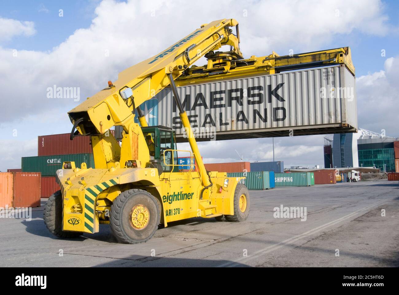 CVS Ferrari reach stacker being used to move shipping containers at
