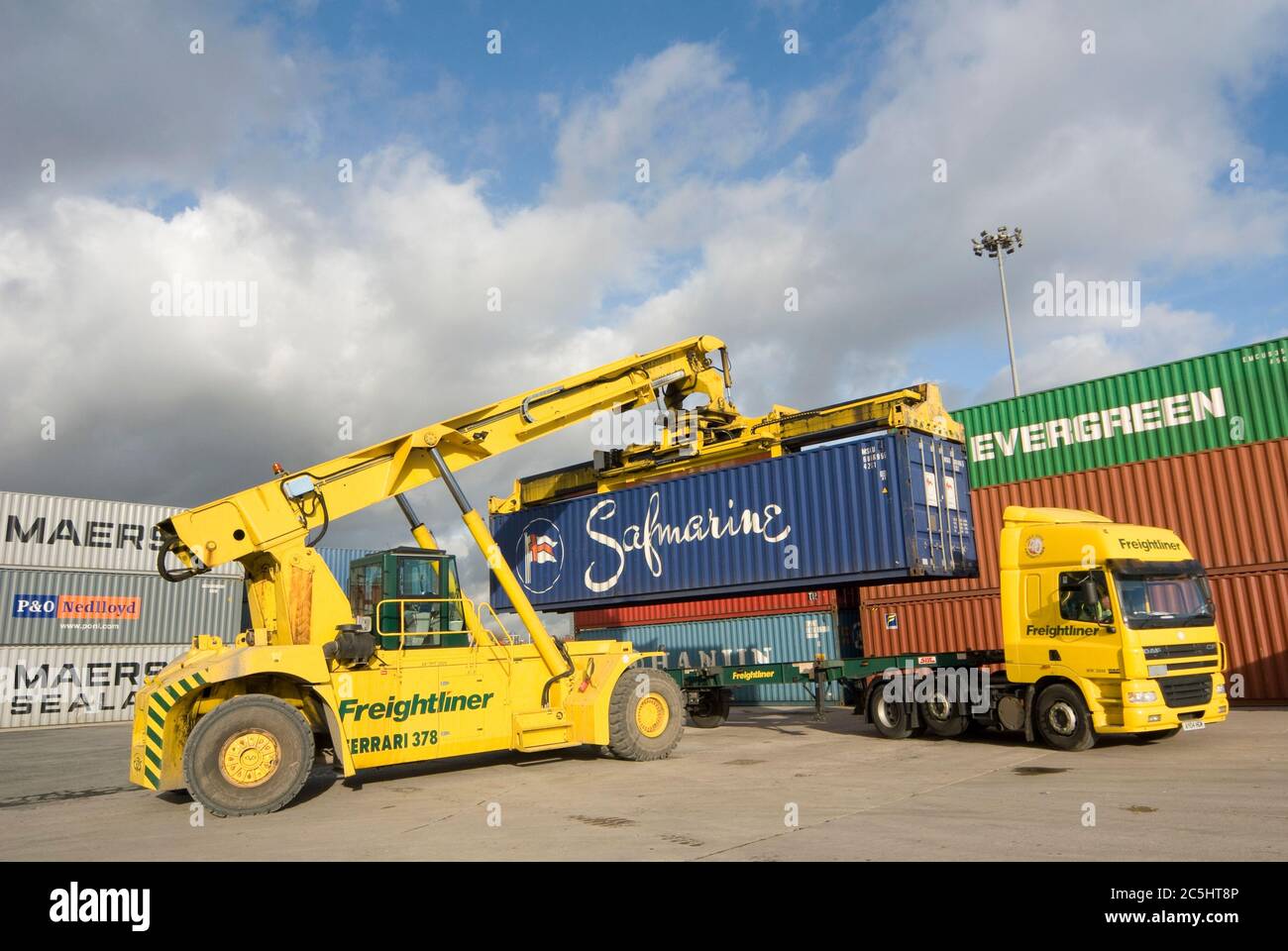 CVS Ferrari reach stacker being used to move shipping containers at