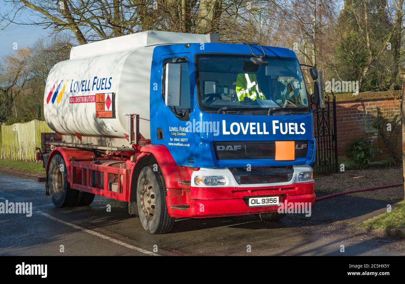 BUCKINGHAM, UK - February 15, 2018. Lovell Fuels heating oil delivery. A tanker lorry delivering domestic heating oil (kerosene), filling an oil tank Stock Photo
