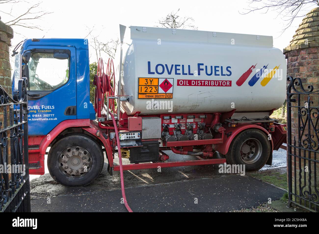 BUCKINGHAM, UK - February 15, 2018. Lovell Fuels oil tanker lorry delivering domestic heating oil (kerosene) to a rural house in UK Stock Photo
