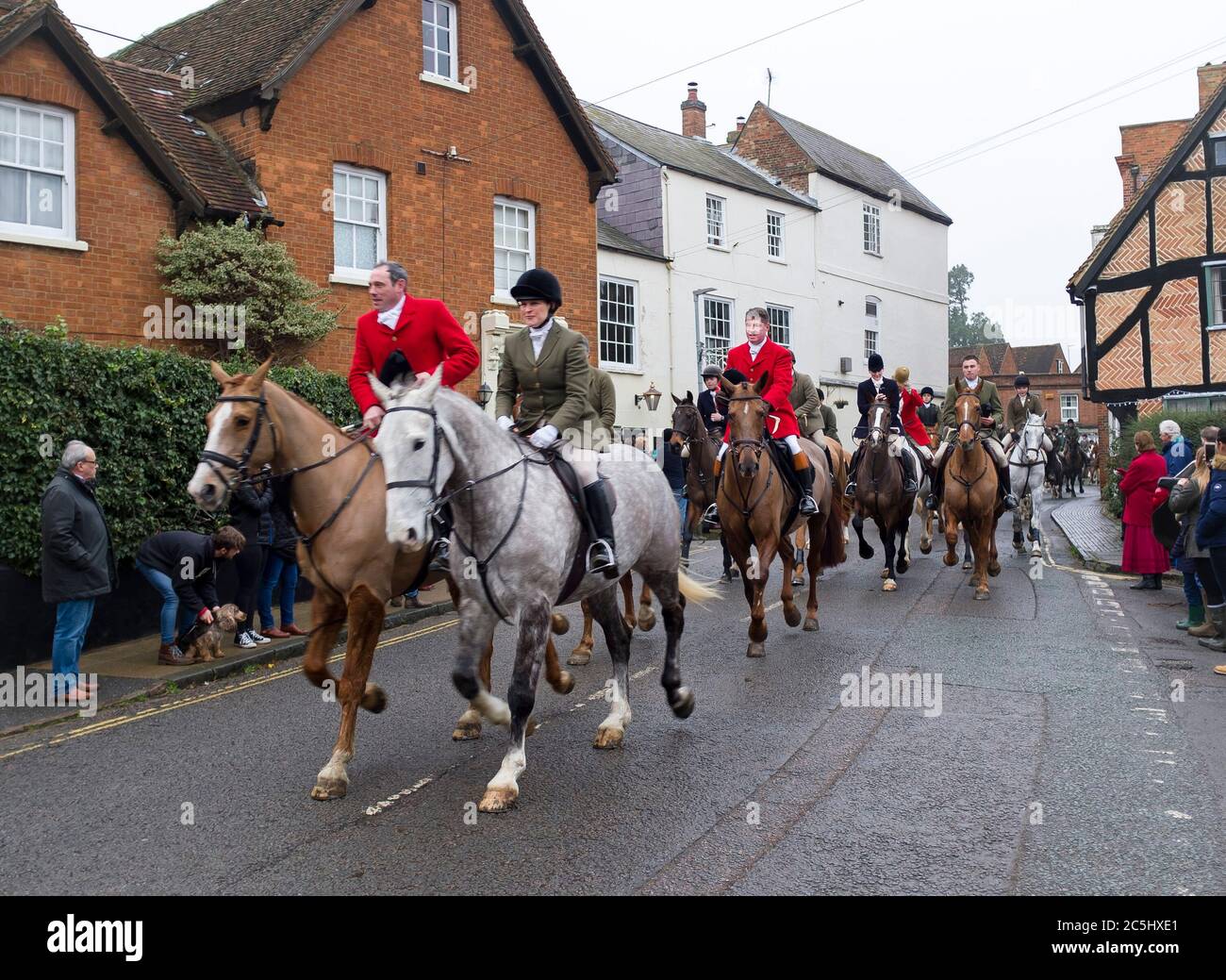 WINSLOW, UK - December 26, 2018. Men and women riding on horseback in a traditional fox hunt on Boxing Day in England Stock Photo