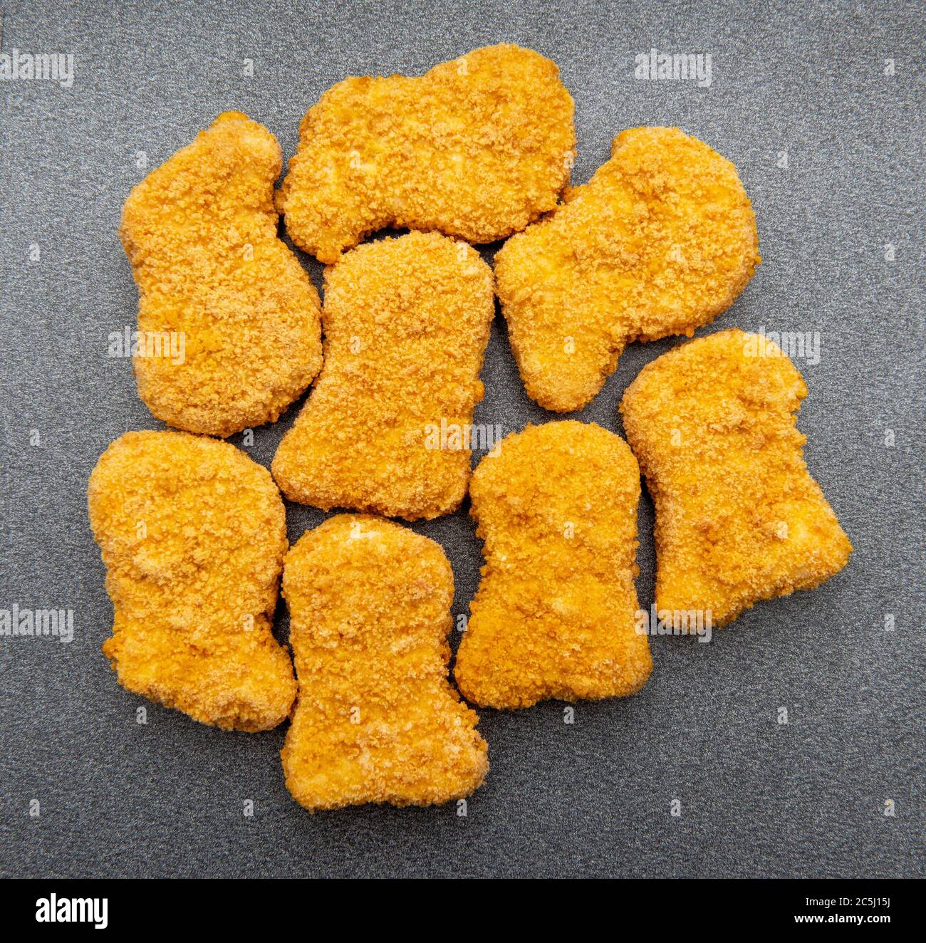 Chicken nuggets on a grey metal background Stock Photo
