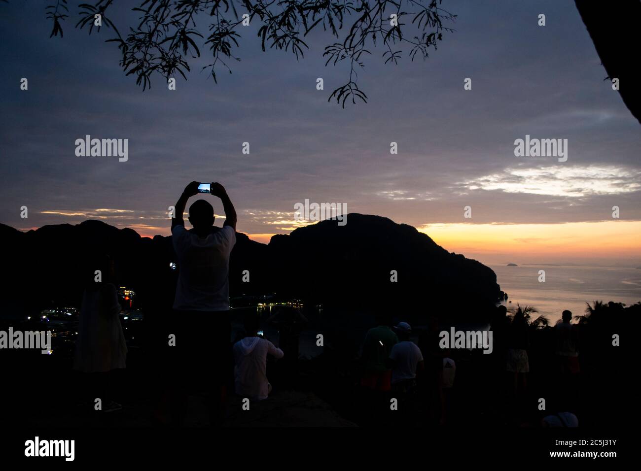 People watching Koh Phi Phi viewpoint at sunset, Thailand Stock Photo