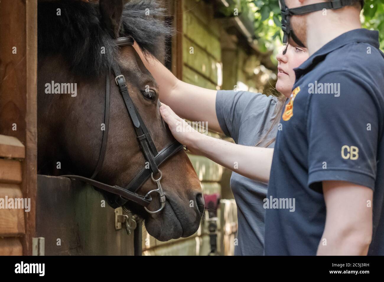 Pair of young University students seen tending there horse in a private ...