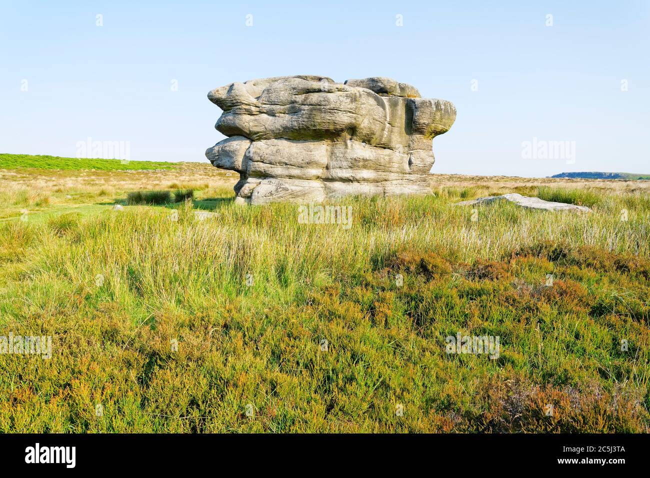 Thr Eagle Stone gritstone outcrop standing on Baslow Edge on asummer morning Stock Photo