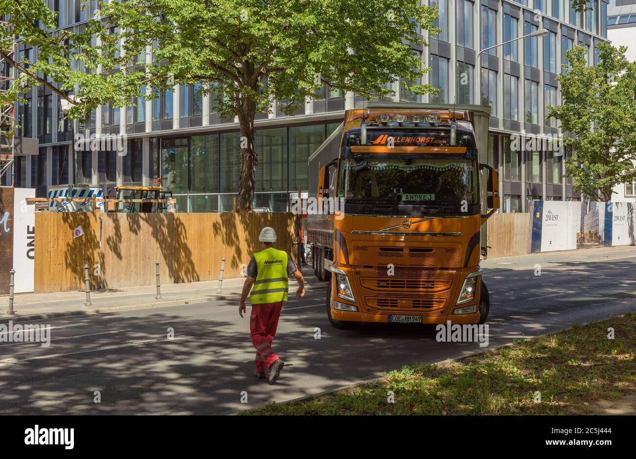Semi truck driving backwards to a large construction site, Frankfurt, Germany Stock Photo