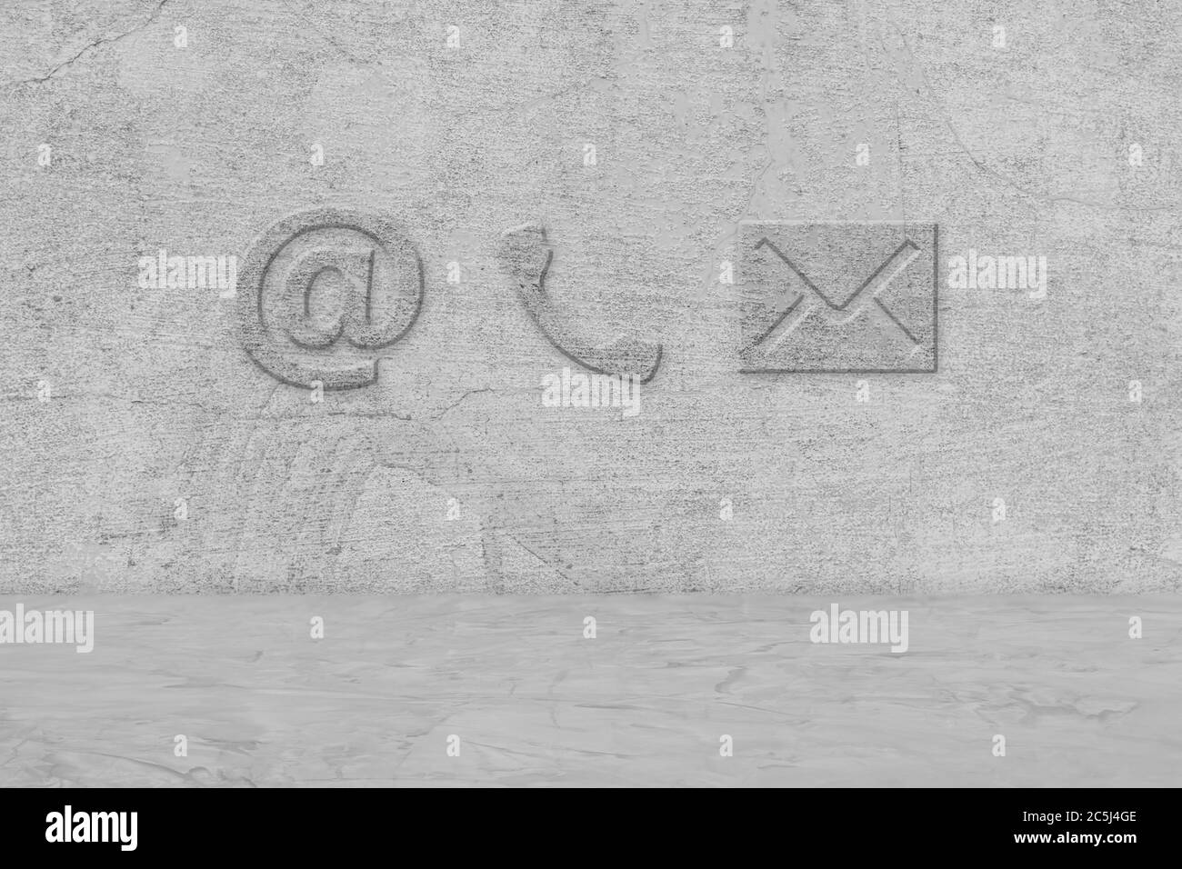 Contact Us. Phone, email and post icons on cement wall Stock Photo