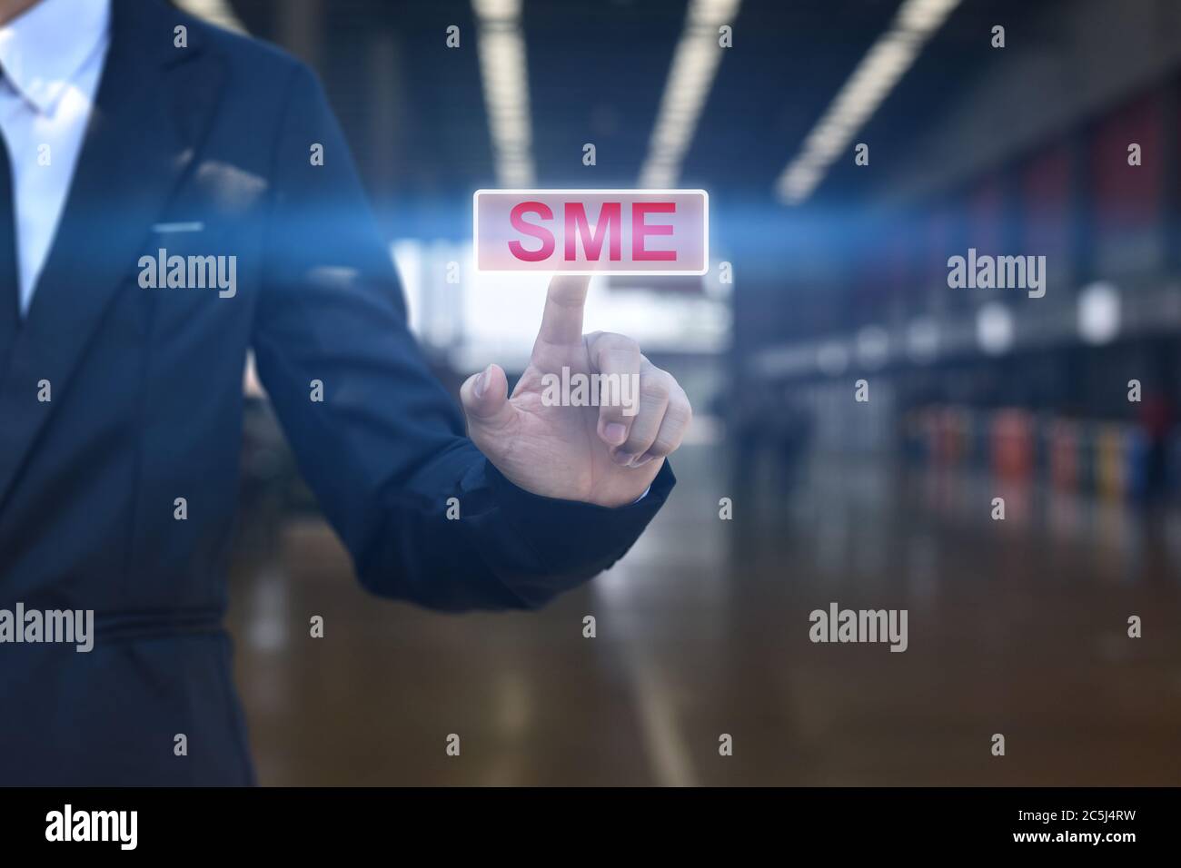 Businessman hand pressing button SME icon. Concept of small and medium-sized enterprises business. Stock Photo