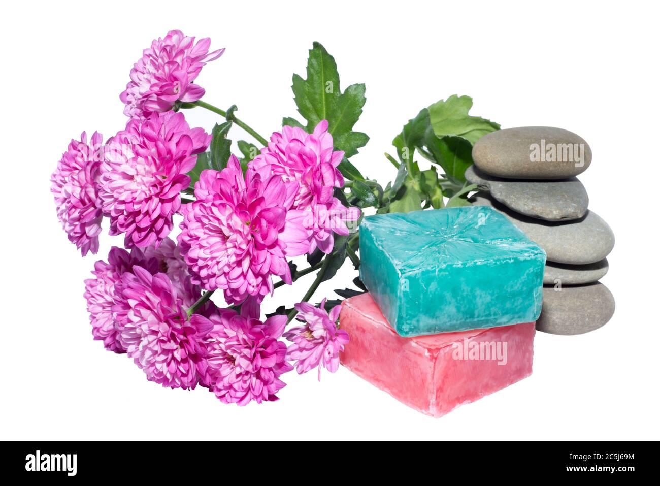 soaps off various shades with grey sone pebbles and flowers Stock Photo