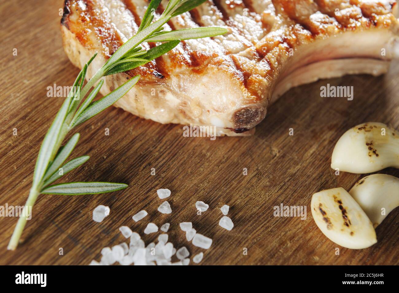 macro shooting steak with salt and baking and garlic on a wooden table. Macro Stock Photo