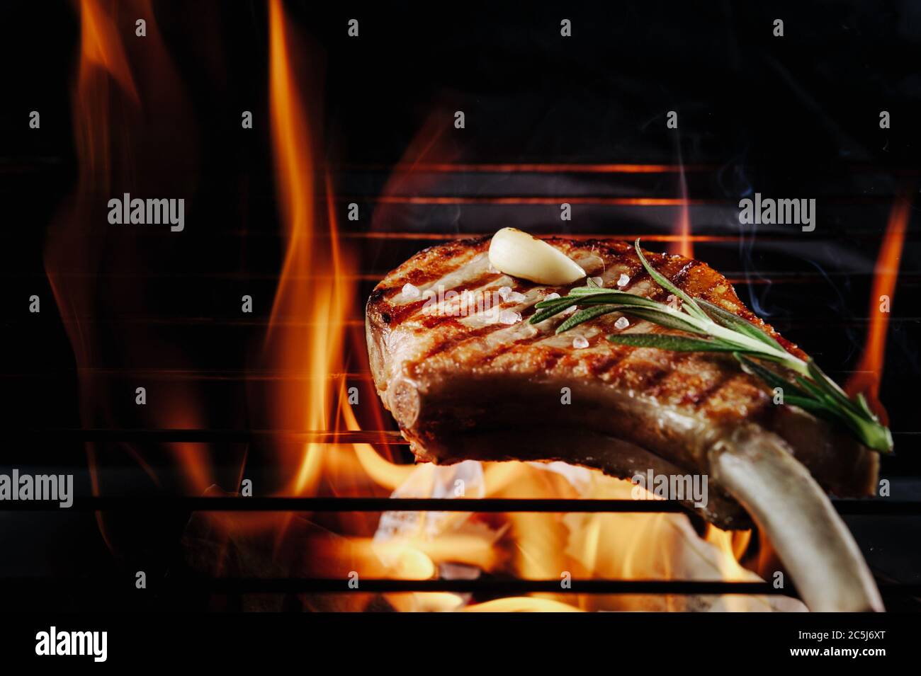 A top sirloin steak flame broiled on a barbecue, shallow depth of field