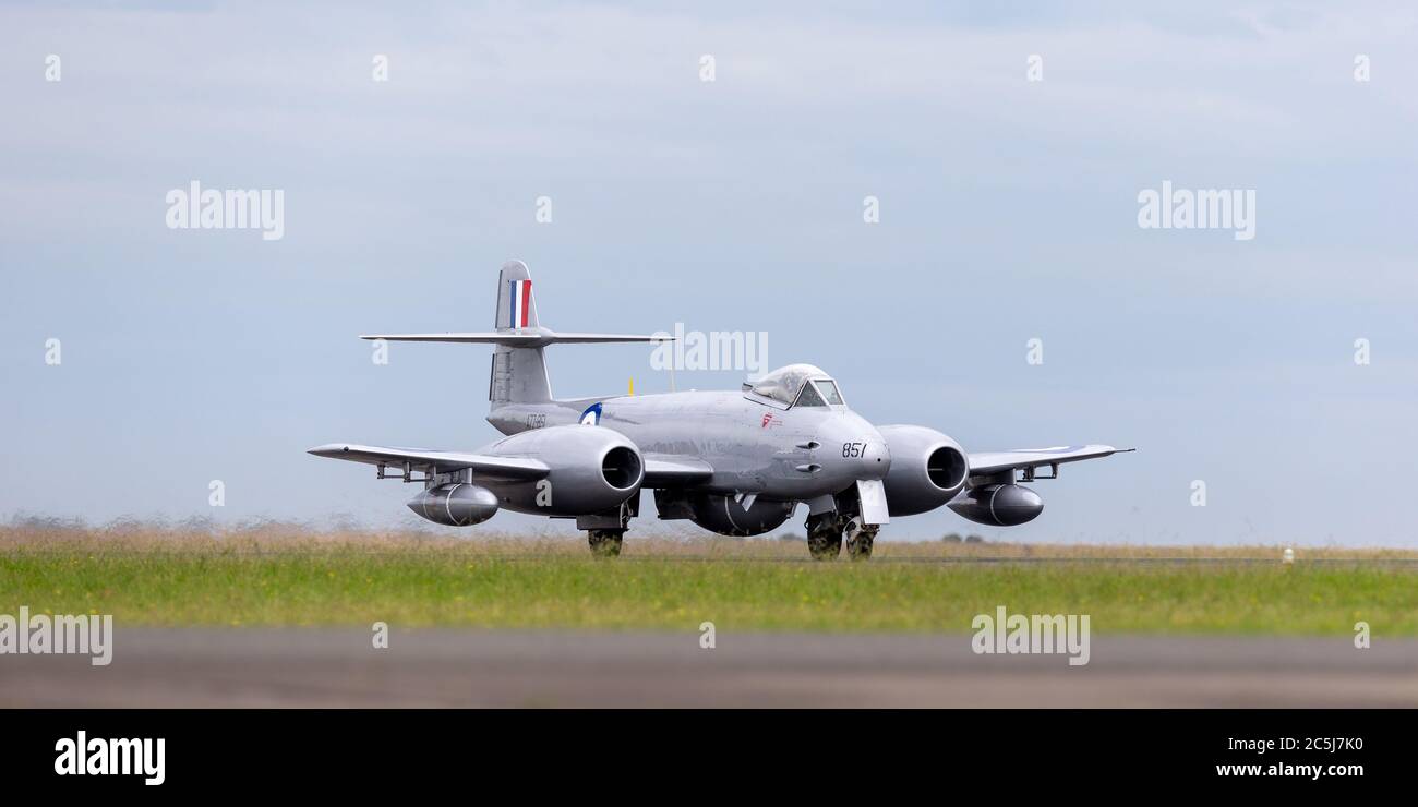 Gloster Meteor F.8 aircraft VH-MBX in Korean War era Royal Australian Air Force (RAAF) markings taxiing down the runway at Avalon airport. Stock Photo