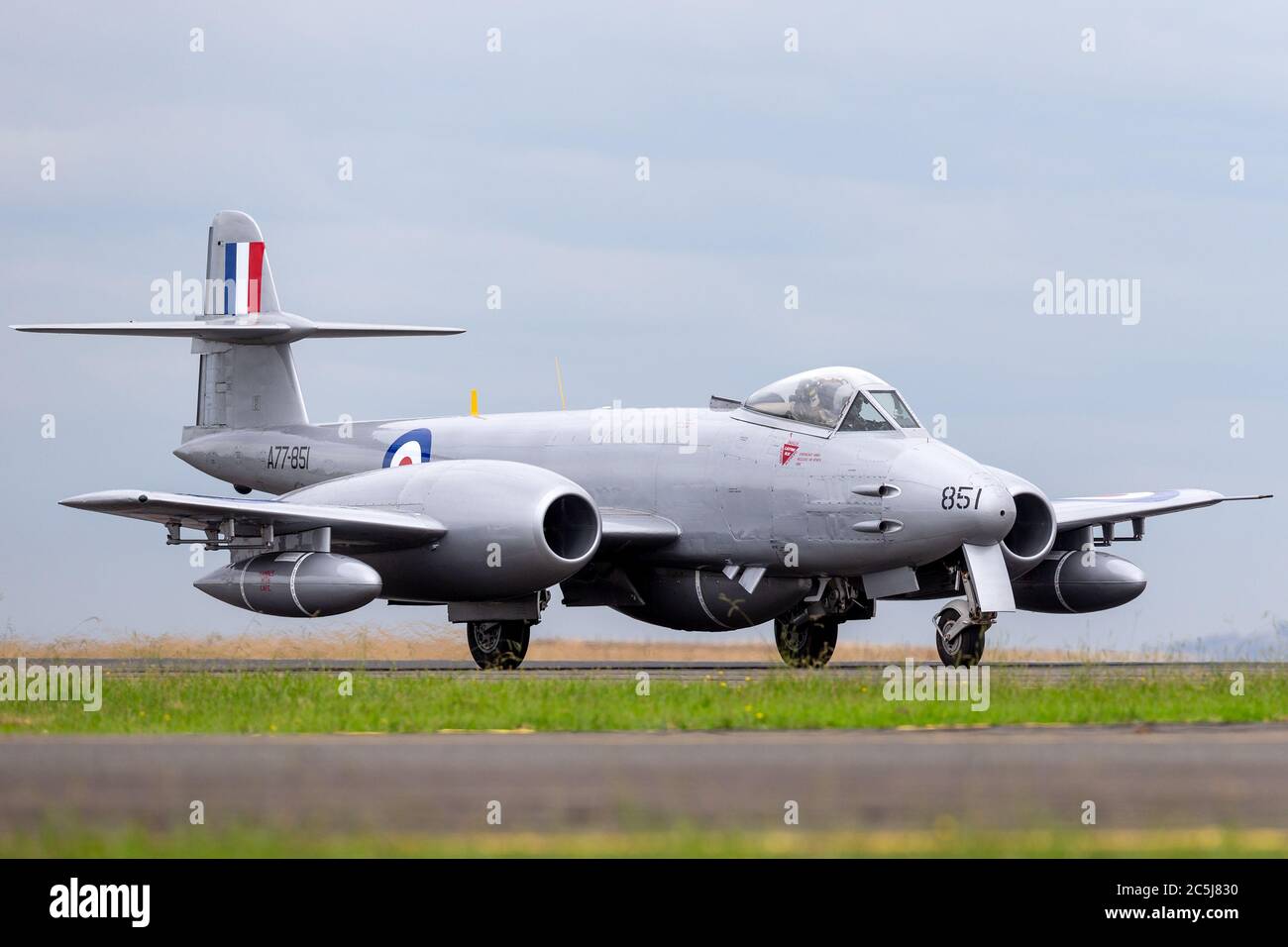 Gloster Meteor F.8 aircraft VH-MBX in Korean War era Royal Australian Air Force (RAAF) markings taxiing down the runway at Avalon airport. Stock Photo