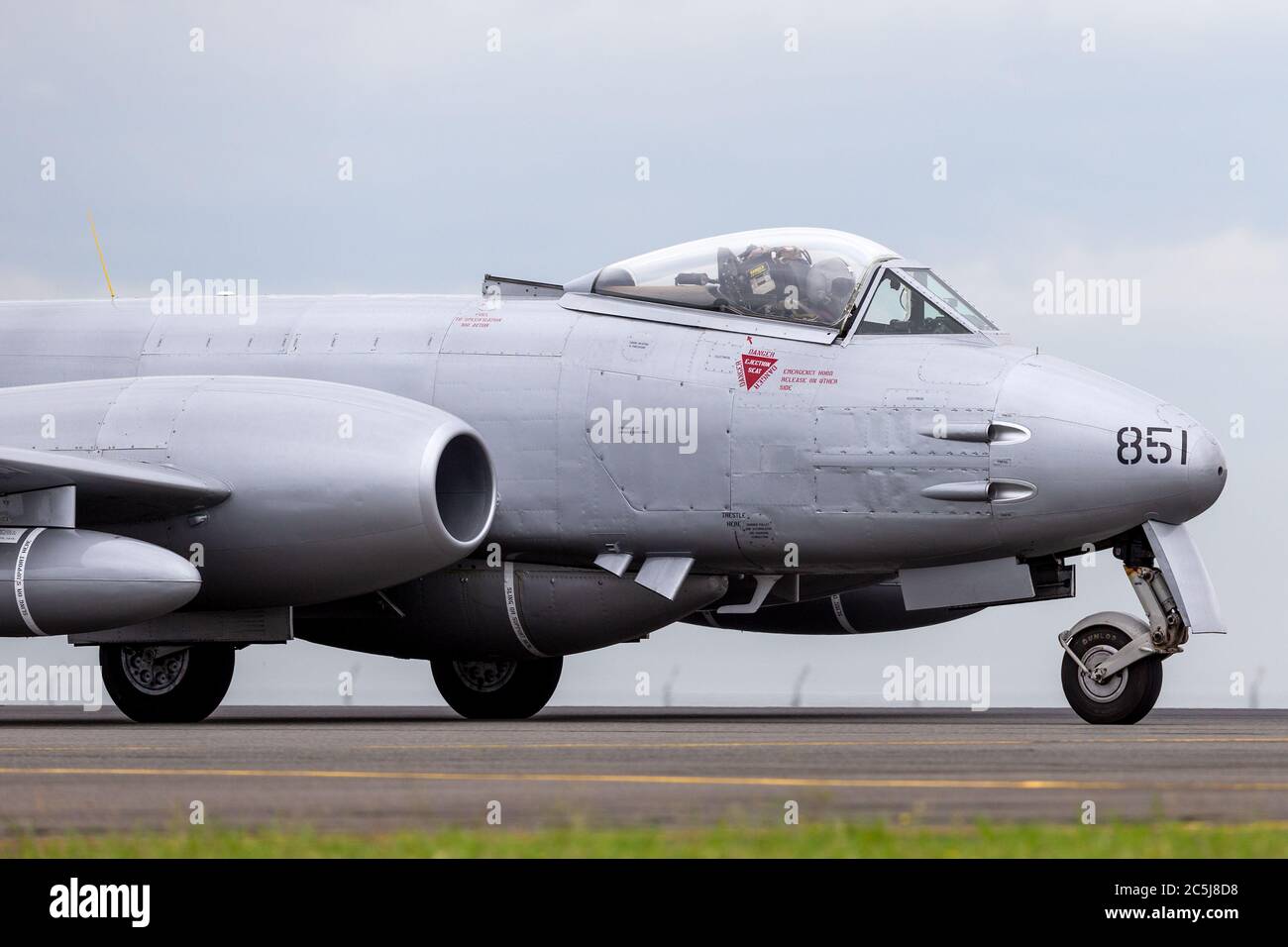 Gloster Meteor F.8 aircraft VH-MBX in Korean War era Royal Australian Air Force (RAAF) markings taxiing down the runway at Avalon airport. Stock Photo