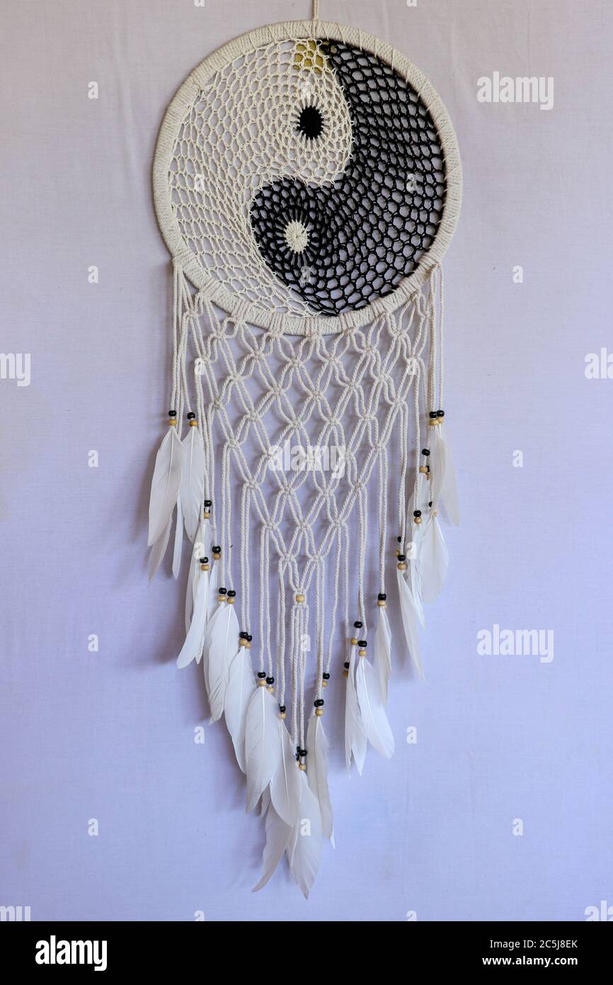 White and black dream catcher Yin Yang. Knitted Indian amulet Stock