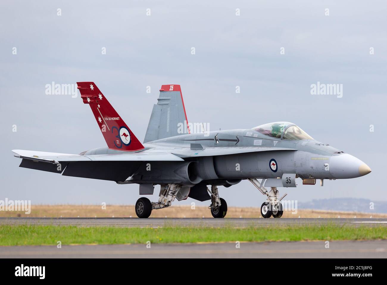 Royal Australian Air Force (RAAF) McDonnell Douglas F/A-18A Hornet multirole fighter aircraft A21-35 with a specially marked tail to commemorate the 3 Stock Photo