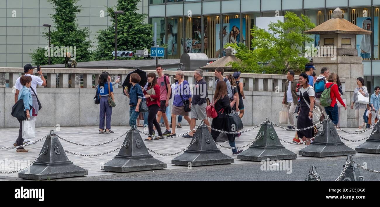 Tourist walking at the Jingu Bashi or Shrine Bridge in Harajuku, Tokyo, Japan Stock Photo