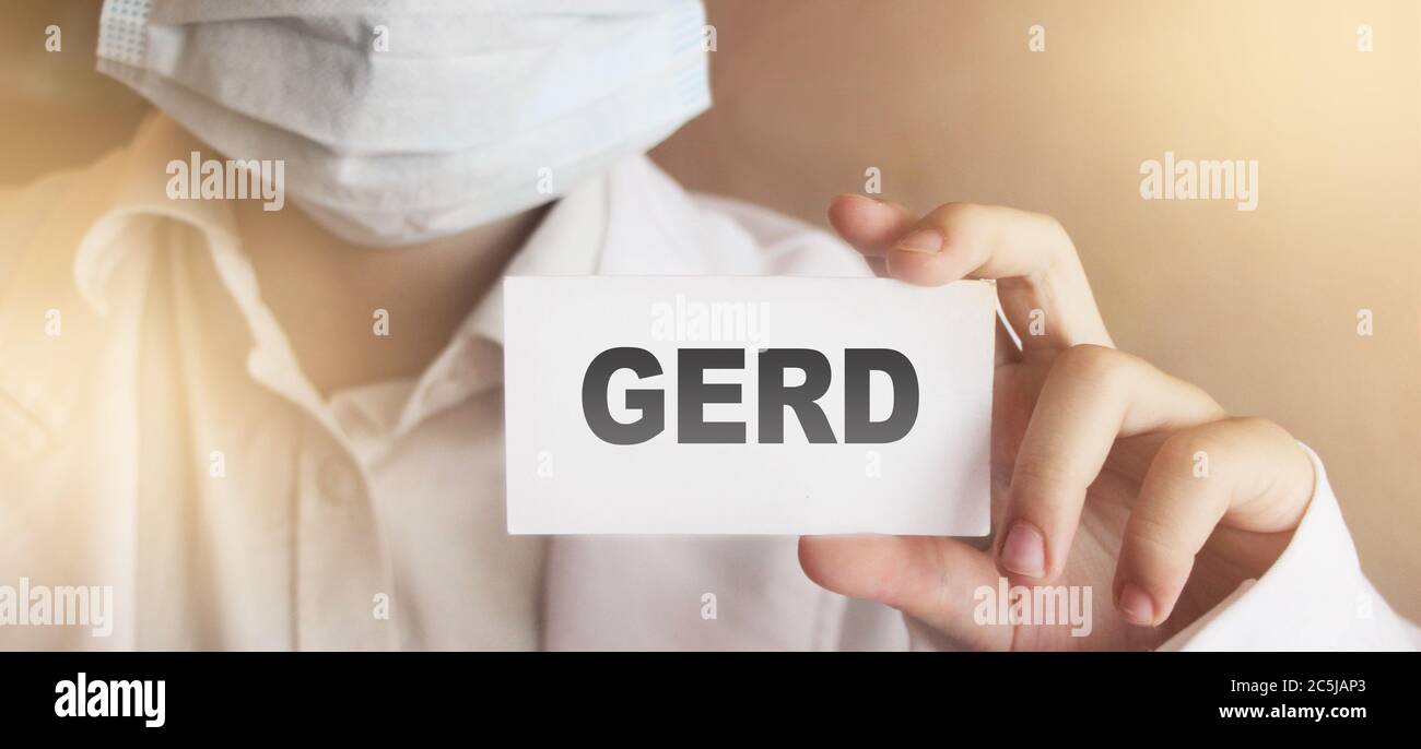 GERD card in hands of Medical Doctor. Gastro Stock Photo